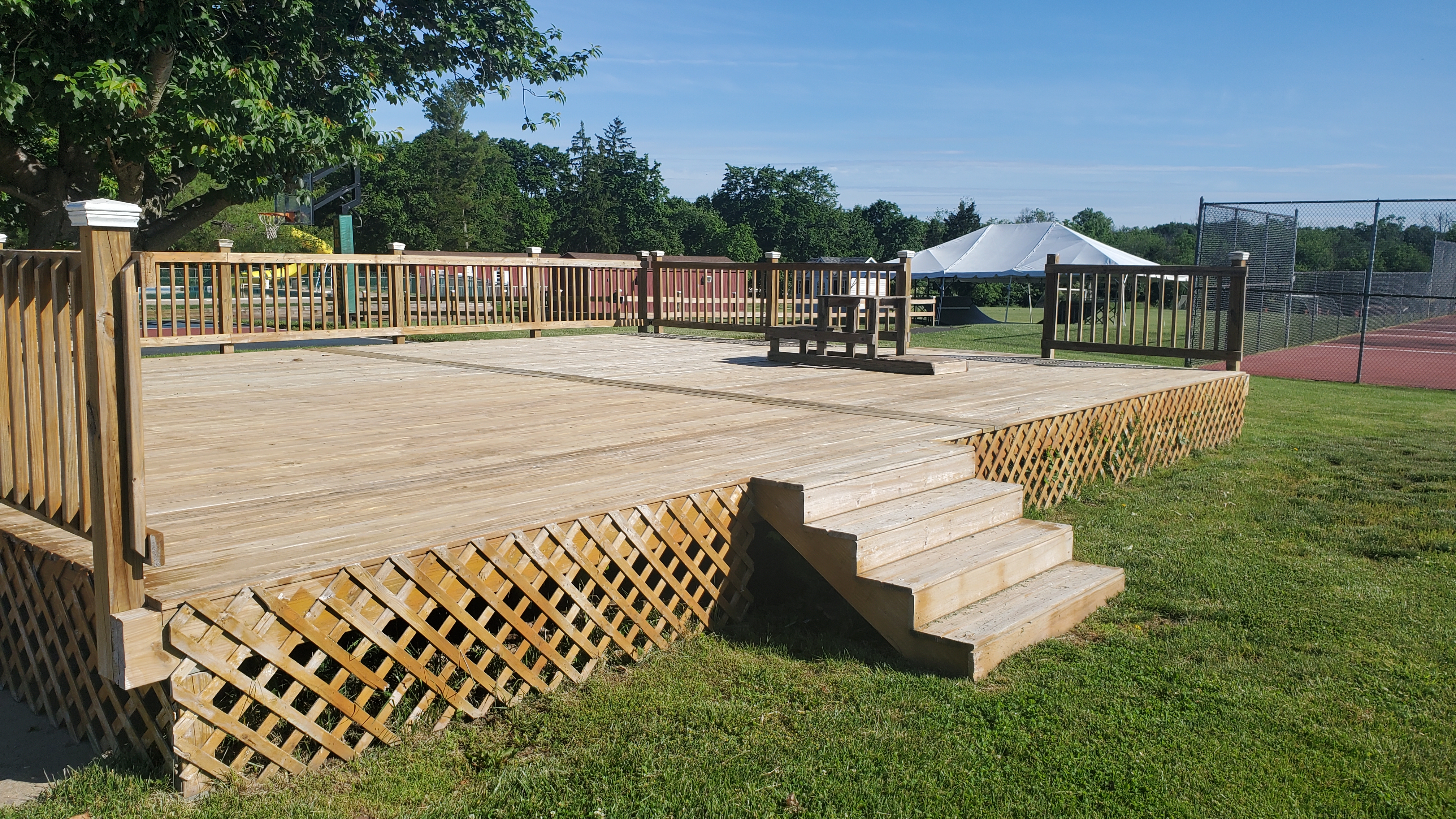 Large commercial wood deck freshly cleaned and restored at a recreational facility