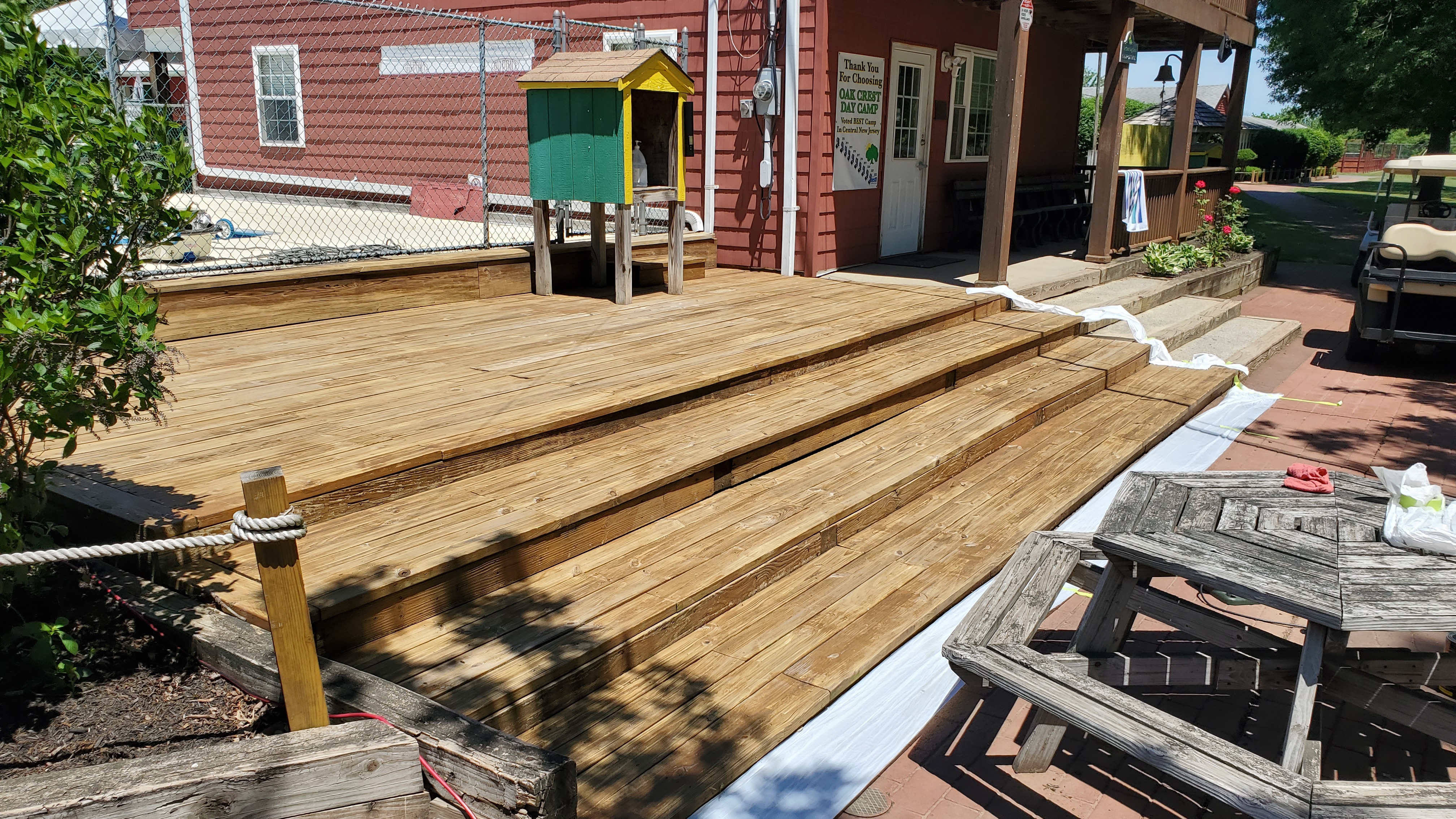 Large commercial wood deck freshly cleaned with natural blonde wood color restored