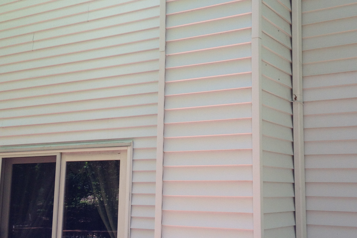 Clean bright vinyl siding after professional soft wash house washing in Florida