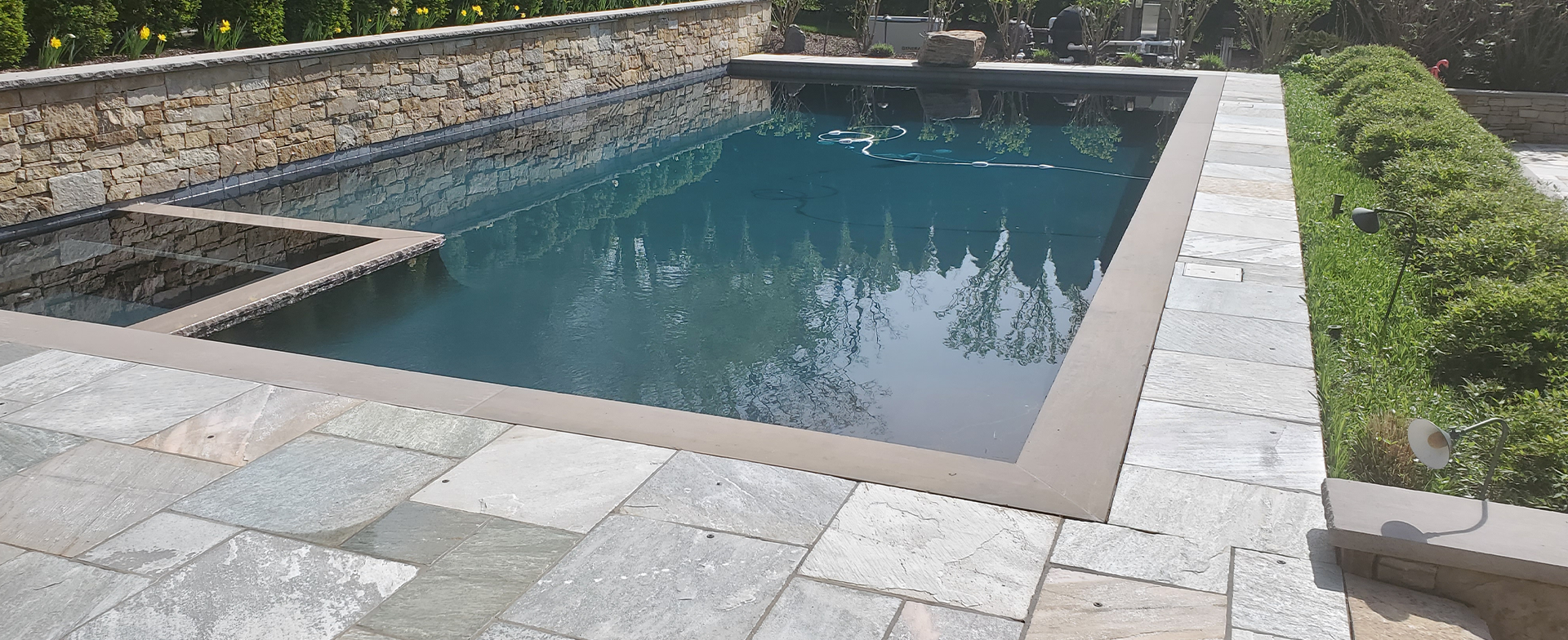 Clean concrete surface restored to near-original bright appearance after professional pressure washing